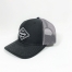 Side profile of charcoal and black trucker hat